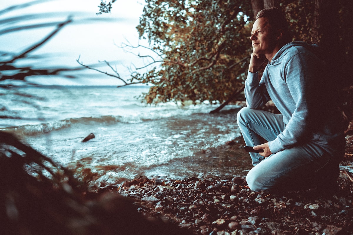 Man reflecting thoughtfully, understanding mental health challenges